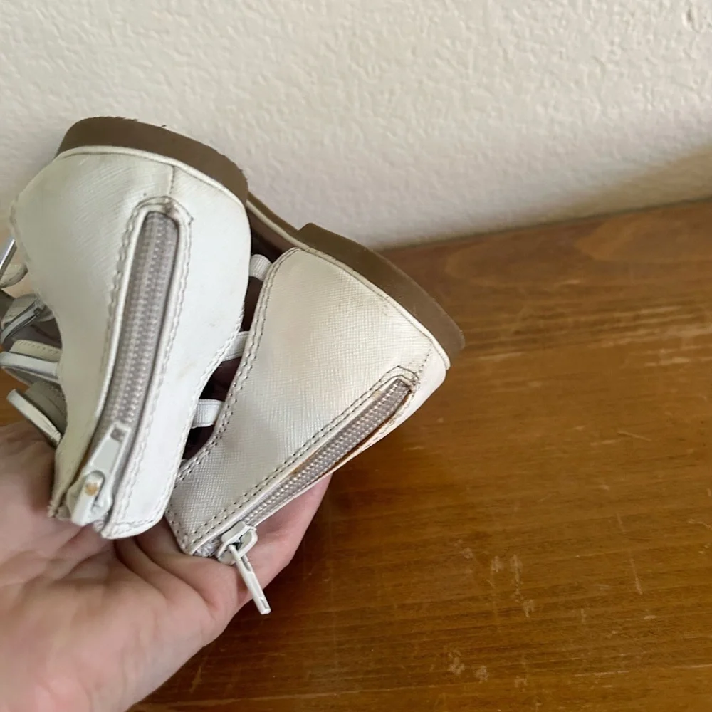 Youth size, one justice, gladiator, white, and silver sandals